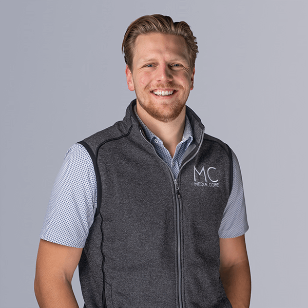 man with short beard smiling at camera